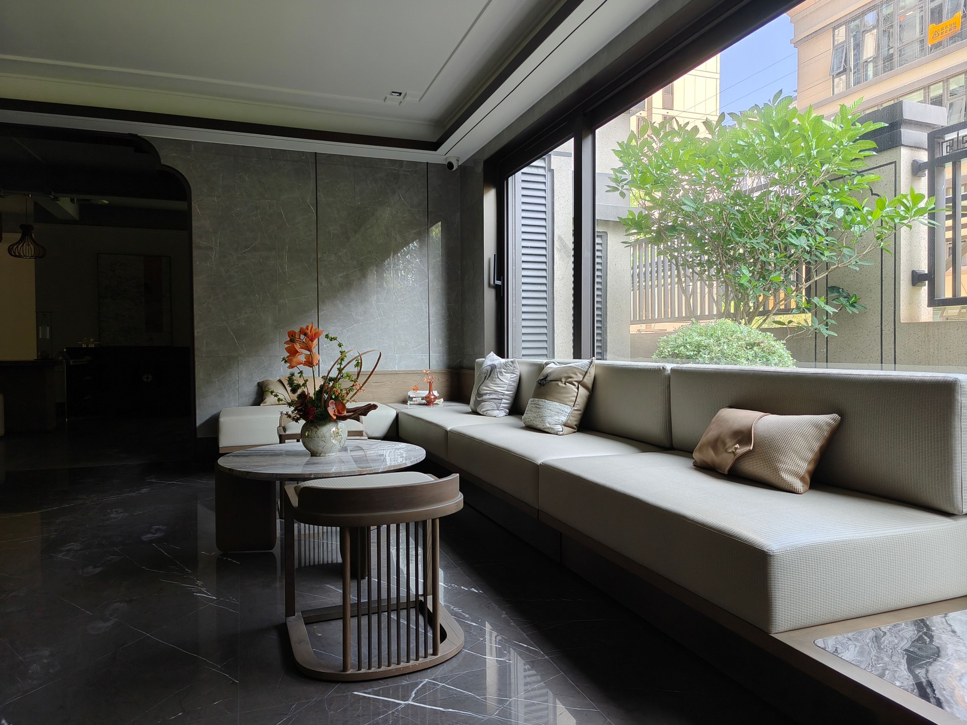 Light living room interior with couch and chairs, panoramic window. Mockup