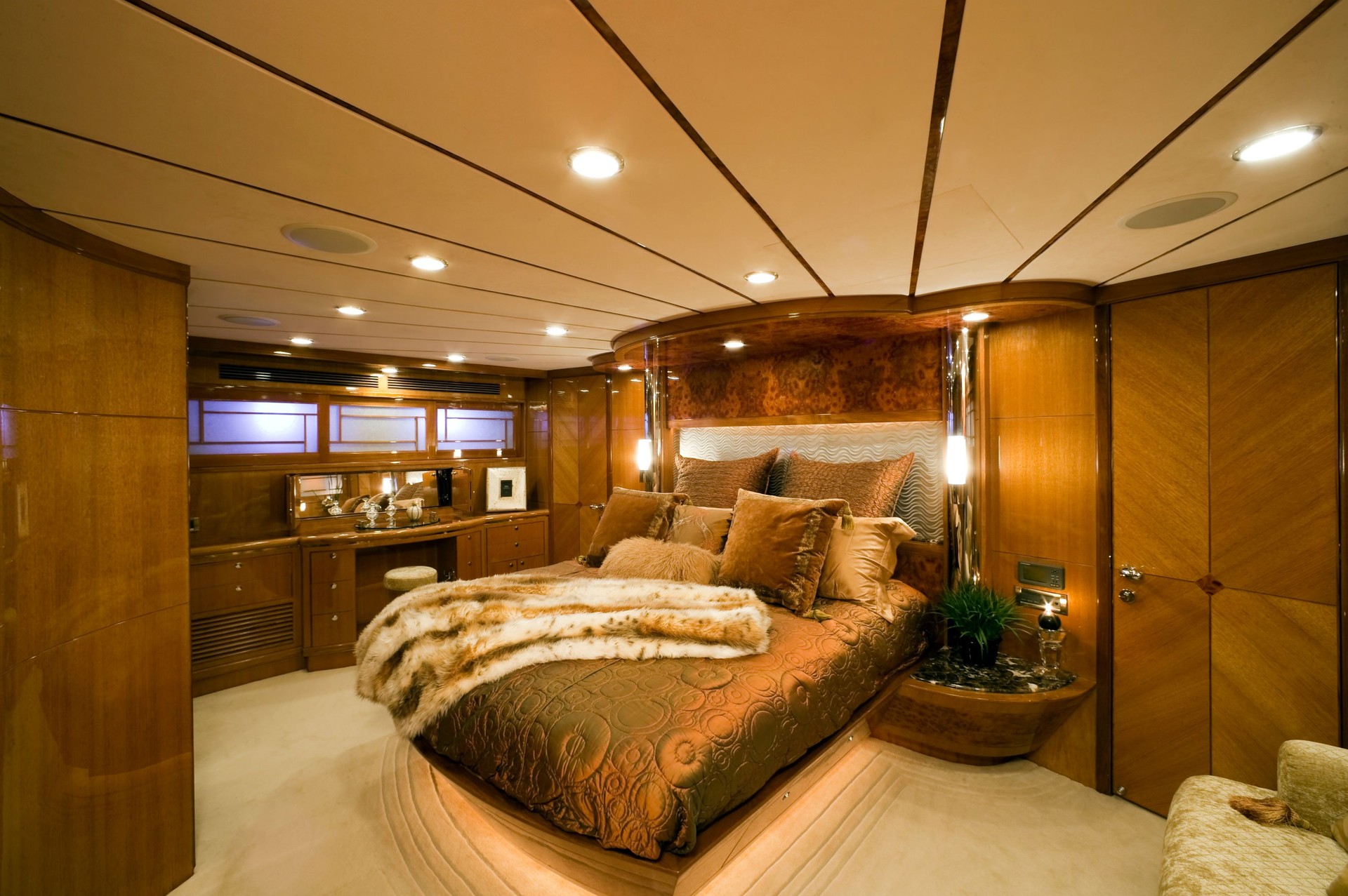 Brown and gold bedroom on yacht